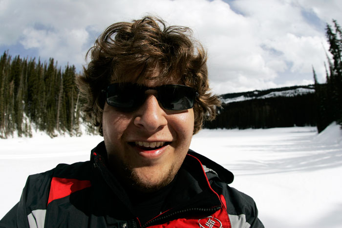 Canon EOS 1D MarkII — 15mm ISO 100 @ f/8 and 1/800 sec — I stopped for a self portrait in front of a snow covered lake while snowshoeing at Mesa Lakes.