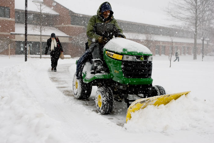 Honorable Mention Feature - Ray Holtmann plows the sidewalk March 4 around the Quad just before Webster University closed for the day. Holtmann has been out plowing since 6 a.m. and is going to keep plowing until he gets called in for the night. He said he would begin plowing again at 6 a.m. the next day and have the sidewalks cleared by 8 a.m. to keep it safe for students.