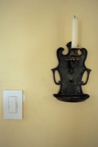 A light switch and candle stick on the wall in the dining room at Ken Stuckenschneider's home. ©2009 Max Gersh | St. Louis Post-Dispatch