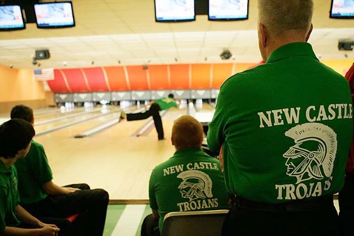 Trojans head coach Ronald Ragan (right) watches over his team during the first round of bowling Sunday morning at Rose Bowl for the Indiana High School Bowling Club Regional Tournament. The tournament was scheduled for Saturday but heavy snow in the area left many counties under a snow emergency. (C-T photo Max Gersh)