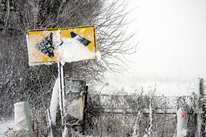 Blowing snow caked onto a street sign near memorial park in New Castle, IN. (C-T photo Max Gersh)