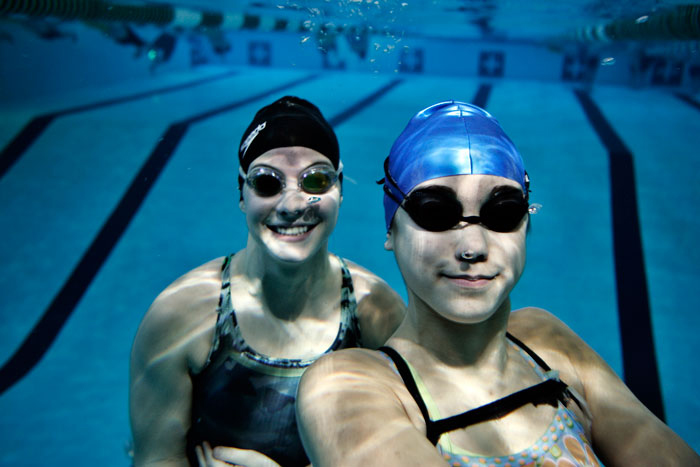 New Castle swimmers Aimee Haddix, left, and Hannah Espiritu pose for an underwater photo at Parkview Pool. The two swimmers are competing in today's state final. (C-T photo Max Gersh) ©2010