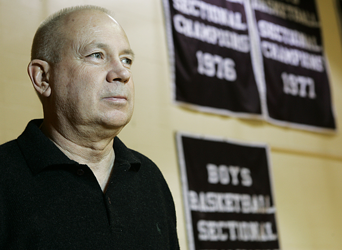 Former Tri coach Don Schwarzkopf looks out at the high school basketball court with three sectional championship banners hanging in the background. Schwarzkopf won all three of the titles. (C-T photo Max Gersh) ©2010