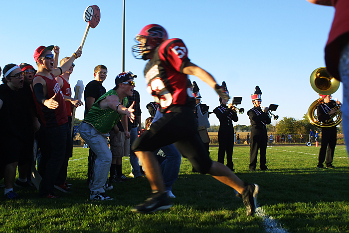 Knightstown's Jordan Jessup runs through a tunnel of fans at the beginning of the Panthers' game agaisnt Eastern Hancock. (C-T photo Max Gersh) ©2010