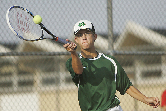 New Castle's A.J. York volleys against an Anderson player Thursday afternoon during the No. 3 singles match. York lost in two sets, 6-3, 6-4. (C-T photo Max Gersh) ©2010