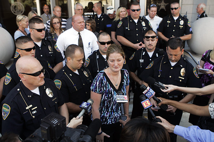 Lesley Phillips, wife of fomer Greenfield officer Will Phillips, speaks to the media Tuesday afternoon outside of the Henry County Justice Center. Phillips' husband was killed when a vehicle driven by Sue Ann Vanderbeck hit him while he was riding a bicycle during a police exercise in Knightstown on Sept. 30. (C-T photo Max Gersh) ©2010