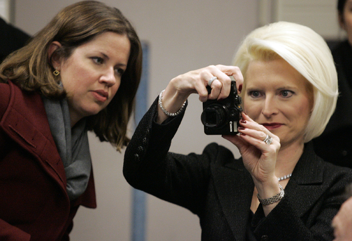 MAX GERSH | ROCKOFRD REGISTER STAR Callista Gingrich (right) takes a photo of her husband, former Speaker of the House Newt Gingrich, Friday, Feb. 4, 2011, while Alicia Melvin watches. Gingrich was in town to participate in the Ronald Reagan centennial celebration. ©2011