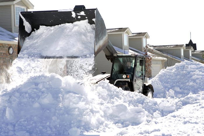 MAX GERSH | ROCKFORD REGISTER STAR Dave Stracka of the Cherry Valley Landscape Center uses a loader to clear out residential driveways Thursday, Feb. 3, 2011, on Trowbridge Lane in Rockford. ©2011