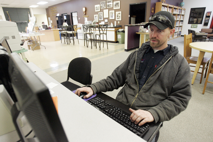 MAX GERSH | ROCKFORD REGISTER STAR Luke Nevdal uses the internet Tuesday, March 1, 2011, on a computer at the Pecatonica Library. Nevdal's laptop is in for repair and he has been using the library's computers to access his e-mail. ©2011