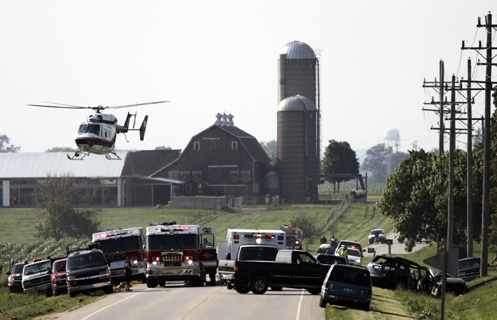 MAX GERSH | ROCKFORD REGISTER STAR A helicopter takes off from the scene of a two-vehicle accident Thursday, June 30, 2011, on Genoa Road near Fern Hill Road in Boone County. ©2011