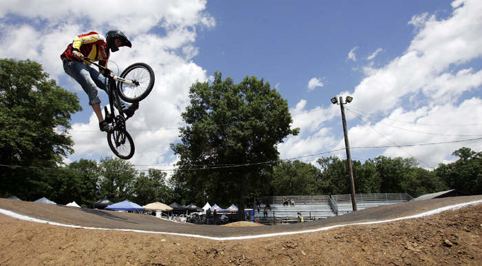 MAX GERSH | ROCKFORD REGISTER STAR Trever White, 15, of Aberdeen, S.D., catches air Thursday, June 16, 2011, during practice runs for the ABA BMX Midwest Nationals at Searls Park in Rockford. ©2011