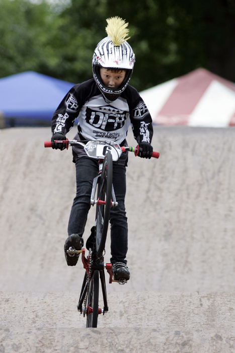 MAX GERSH | ROCKFORD REGISTER STAR Henry Chudzik, 7, of Chicago rides the final section of the track Thursday, June 16, 2011, during practice runs for the ABA BMX Midwest Nationals at Searls Park in Rockford. ©2011