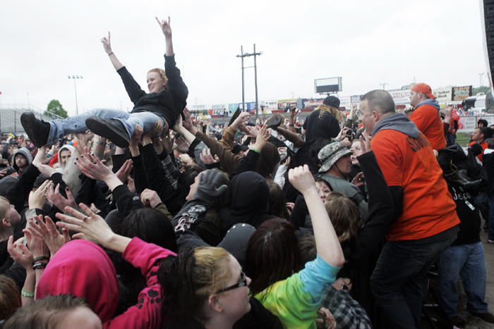 MAX GERSH | ROCKFORD REGISTER STAR Security crews prepare to remove a crowd surfer Saturday, May 14, 2011, during the The Concert at Rockford Speedway in Loves Park. ©2011