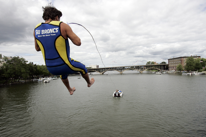 MAX GERSH | ROCKFORD REGISTER STAR Ski Broncs performer Tyler Smith leaps off a tower on the State Street Bridge while being pulled by a boat Sunday, Sept. 4, 2011, during On the Waterfront in downtown Rockford. ©2011