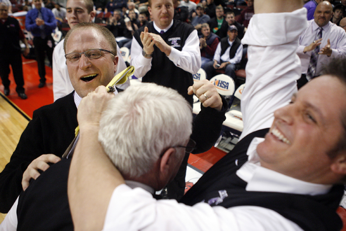 MAX GERSH | ROCKFORD REGISTER STAR Lutheran head coach Tom Guse (from left) celebrates with assistant coaches Jerry Guse and Dean Martineiti Saturday, March 10, 2012, after defeating Seaton Academy in the Class 2A third place game at the Peoria Civic Center. ©2012