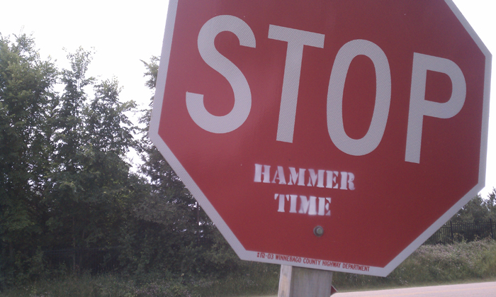 A "hammer time" stamp on a stop sign in rural Winnebago County. Shot using the stock camera on a Droid Incredible. ©2011 Max Gersh