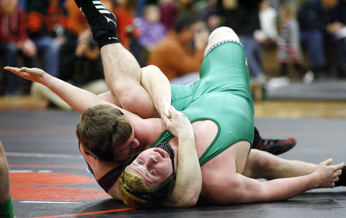 Dakota's Drew Zellmer (left) works to pin Rock Falls' Shawn Skinner in the 195-pound bout Tuesday, Feb. 19, 2013, during the wrestling sectional at Byron High School. MAX GERSH/ROCKFORD REGISTER STAR ©2013