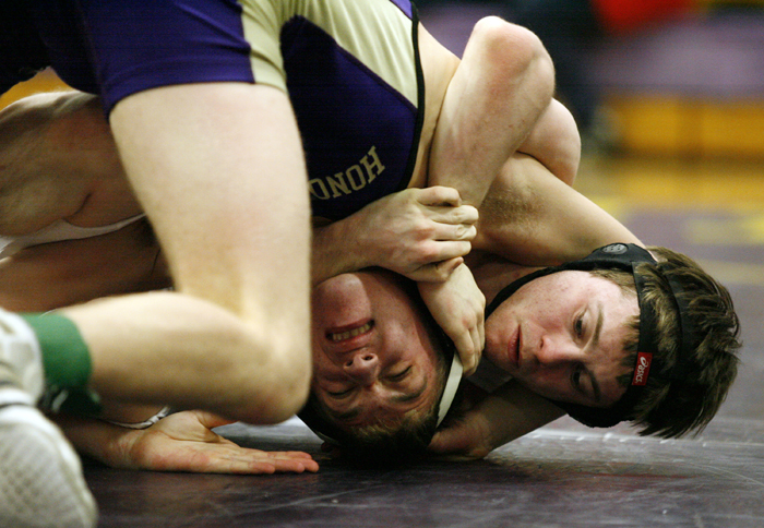 Hononegah's Josh Lawyer (left) works to get free from Freeport's Allan Hornung in the 138-pound fifth place bout Saturday, Jan. 26, 2013, during the NIC-10 conference wrestling meet at Hononegah High School in Rockton. Lawyer went on to win the bout. MAX GERSH/ROCKFORD REGISTER STAR ©2013