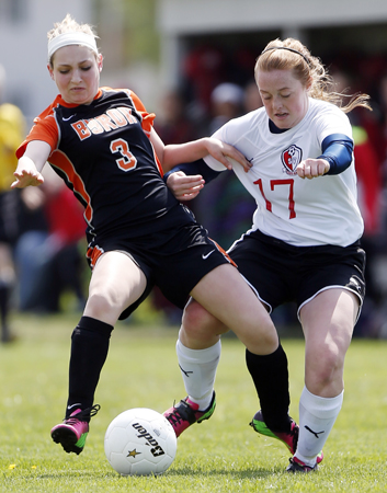 Byron's Kellyn Euhus (3) is knocked off balance while fighting for the ball with Stillman Valley's Carley Frost (17) Saturday, May 11, 2013, during a game at Stillman Valley High School. MAX GERSH/ROCKFORD REGISTER STAR ©2013