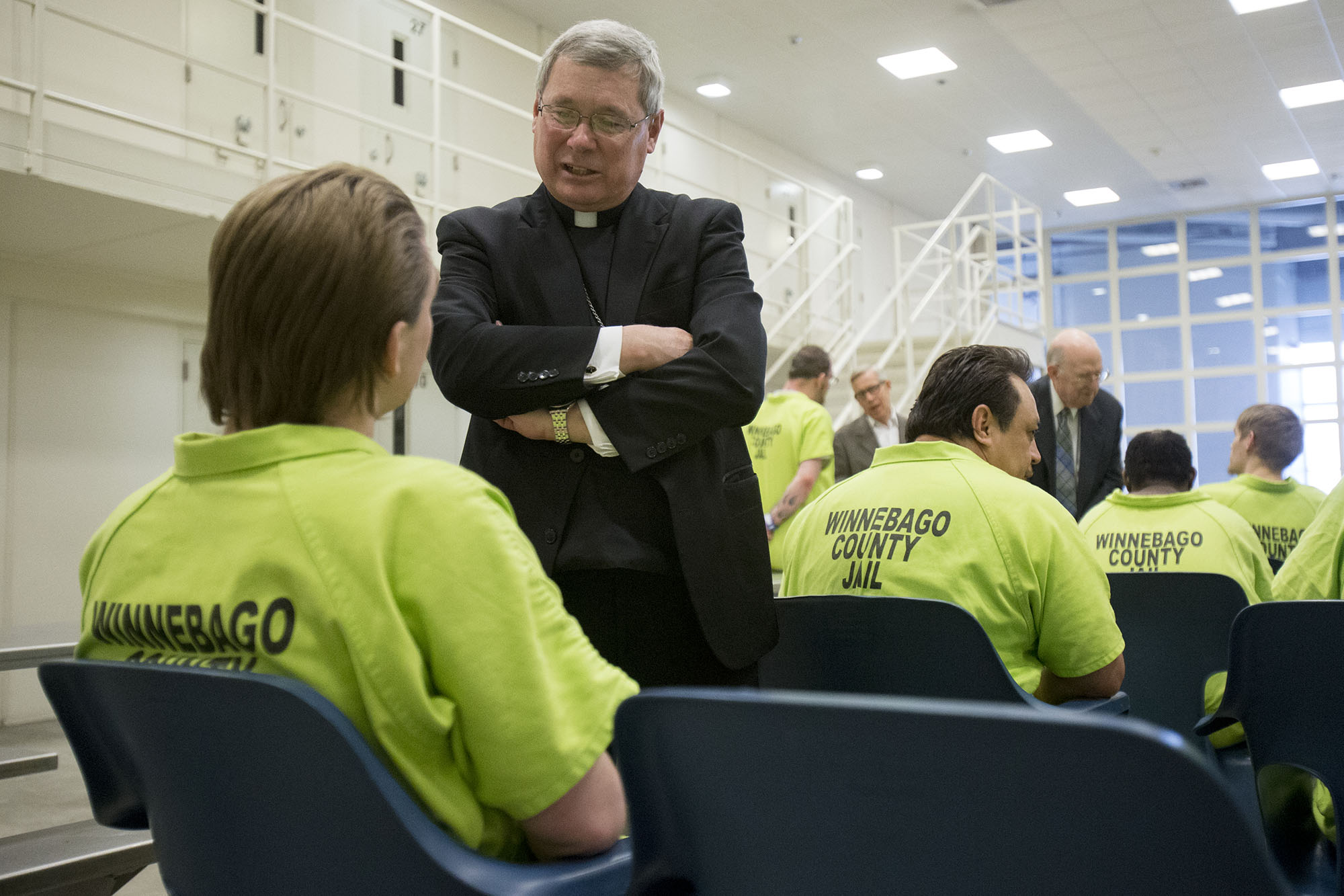 Bishop David J. Malloy talks with Nathanial Davis on Sunday, March 27, 2016, after Easter Mass at the Winnebago County Jail in Rockford. MAX GERSH/STAFF PHOTOGRAPHER/RRSTAR.COM ©2016
